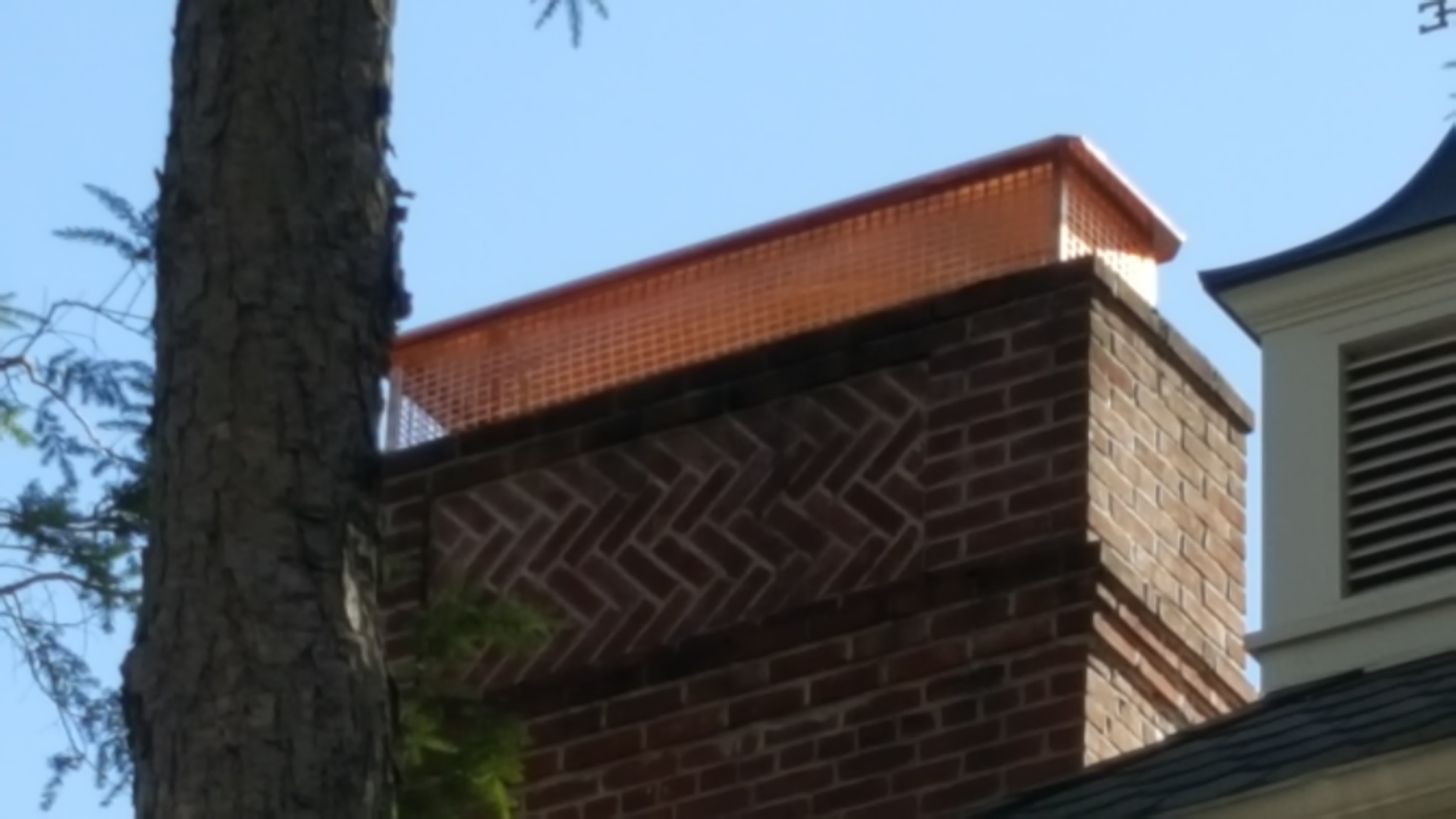New stainless steel chimney cap installed in Babylon, NY