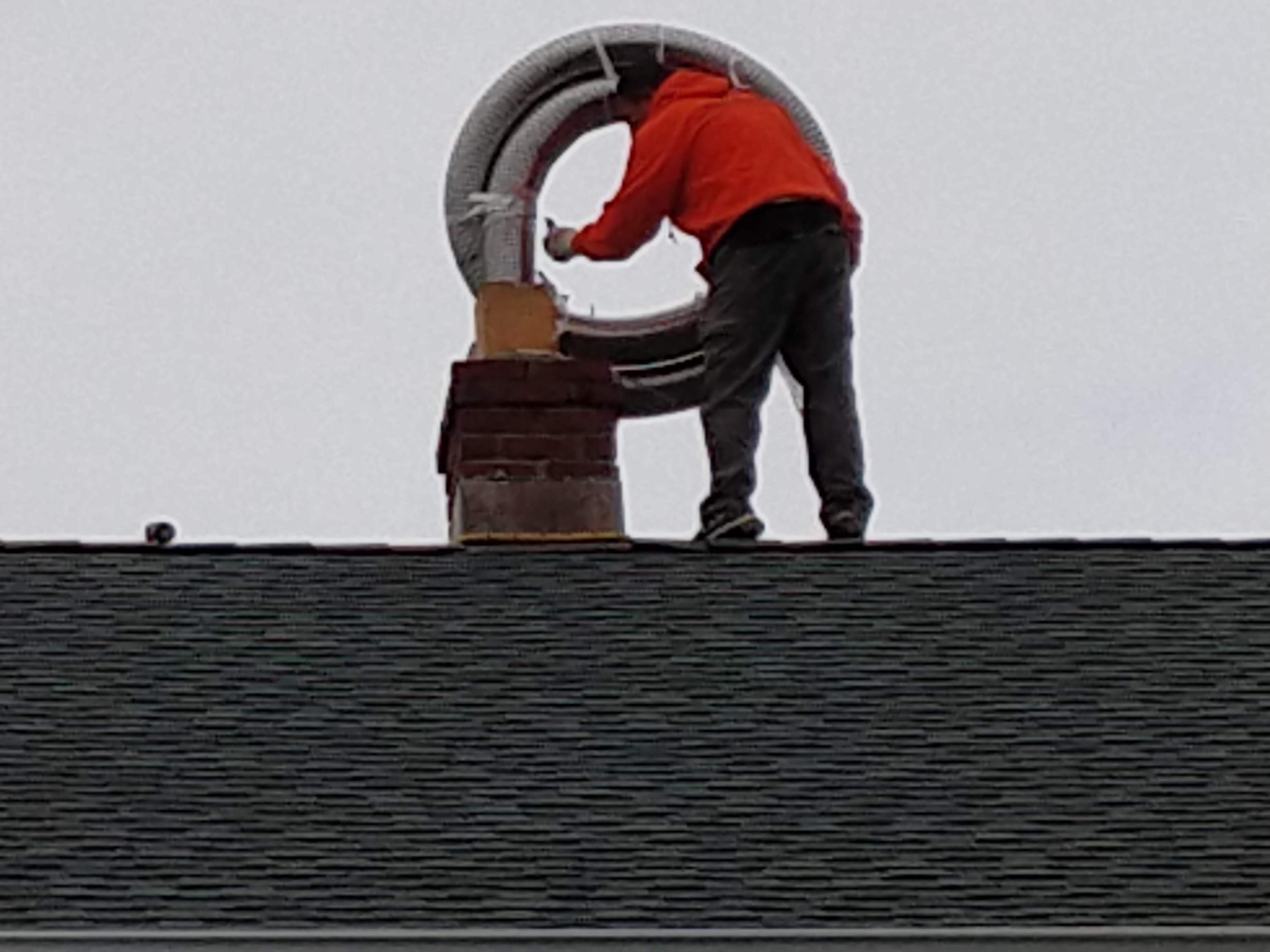 Flexible stainless chimney liner being installed in Babylon, New York