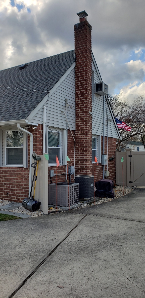 Professional chimney repointing restoring brick joints in Babylon, NY