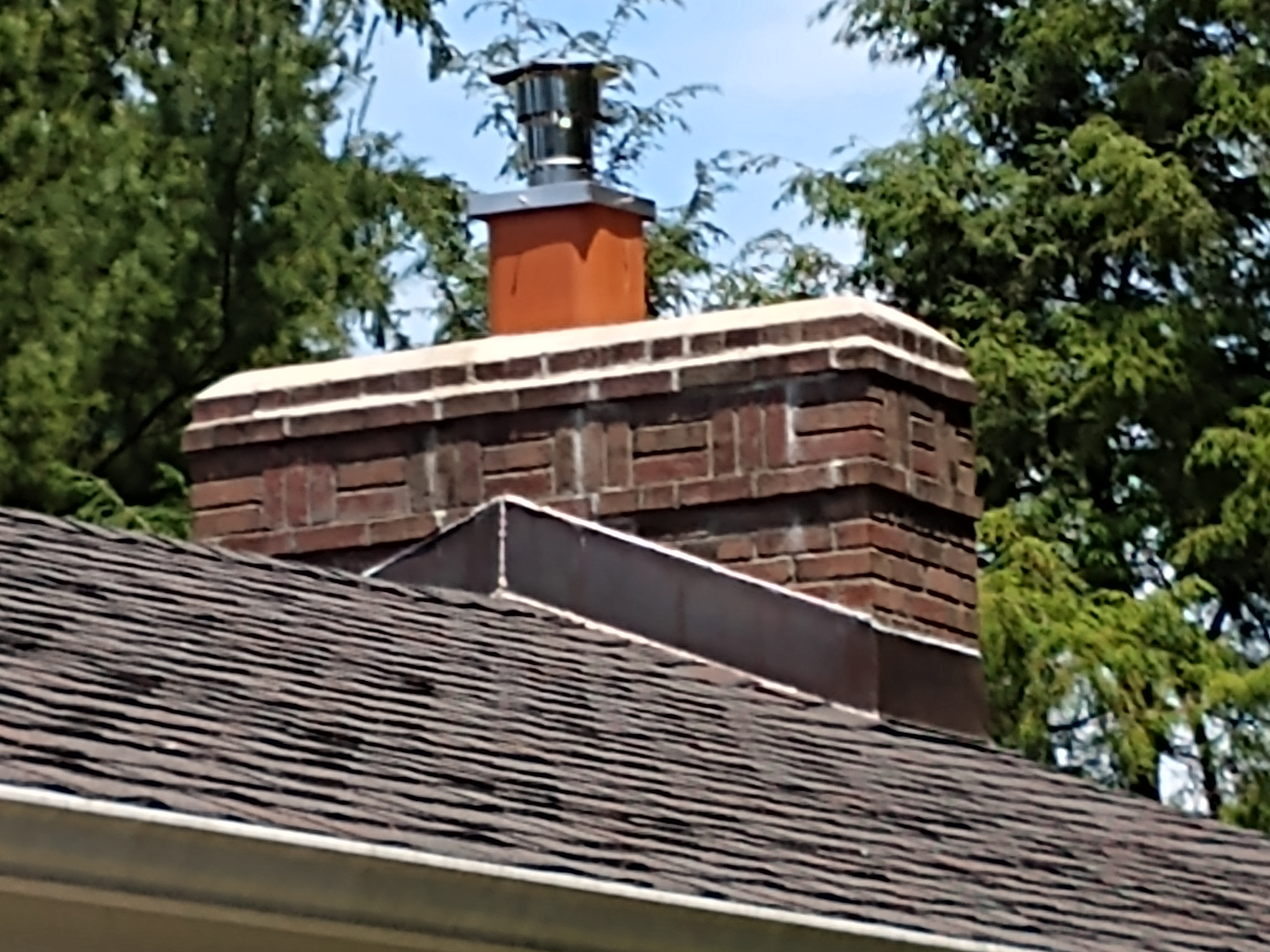Stainless steel chimney cap with animal guard in Babylon, New York